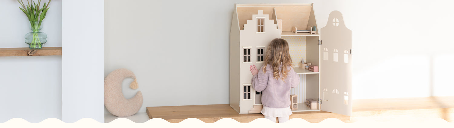 A soft-toned Babiem header showing a young child playing with a wooden dollhouse. The scene features minimalistic decor, including a vase with flowers and a crescent-shaped cushion, reflecting Babiem’s warm and natural style.